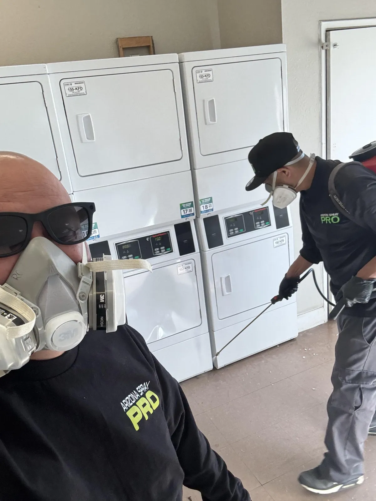 AZ Spray Pro technicians treating a commercial laundry area